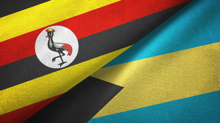 Fototapeta premium Uganda and Bahamas two flags textile cloth, fabric texture 