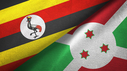 Fototapeta premium Uganda and Burundi two flags textile cloth, fabric texture 