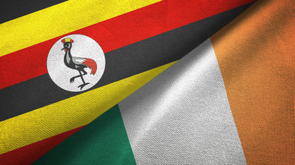 Fototapeta premium Uganda and Ireland two flags textile cloth, fabric texture