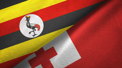 Fototapeta premium Uganda and Tonga two flags textile cloth, fabric texture