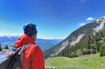 Fototapeta na wymiar hiker looking up mountain during his trip