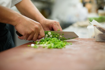 chef Slicing vegetables on wood background, food, 