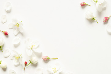 Flowers composition. Pattern made white and pink flowers with space for text on white paper. Mockup. View from above. - Image