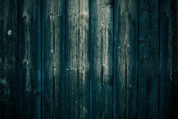 Texture of shabby dark green boards. Oak vintage table. Black green wooden planks background. Dark green dirty wooden fence, surface, wood wall texture.