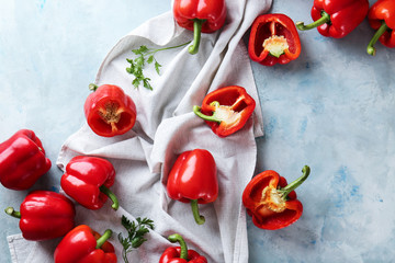 Ripe red peppers on color background