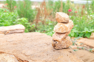 Stone stack on the rock sheet in the garden. for nature background.