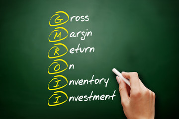 GMROII - Gross Margin Return on Inventory Investment acronym, business concept on blackboard
