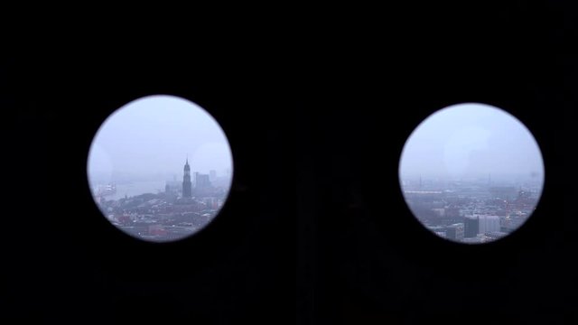 Double porthole lookout from St. Petri church towards St. Michaelis church in Hamburg after sunset