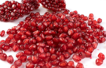 Scattered Pomegranate Seeds Isolated on White Background