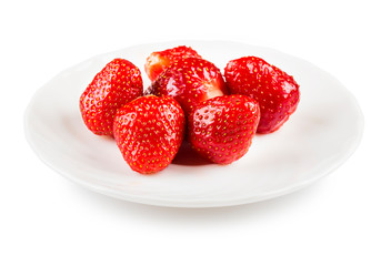 Strawberries on white plate isolated on white.