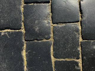 Black paving stones on the square