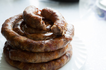 delicious juicy baked sausages in the oven