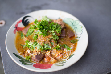 Nam Nguan Noodle, Rice noodles with spicy pork sauce.