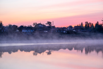 Landscape with the image of village on lake Seliger in Russia