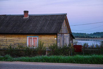 Landscape with the image of village on lake Seliger in Russia