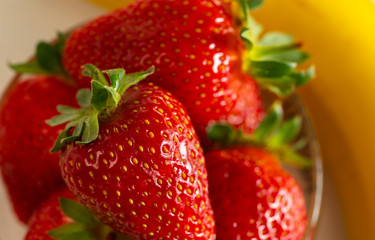 strawberries in a glass on a white background