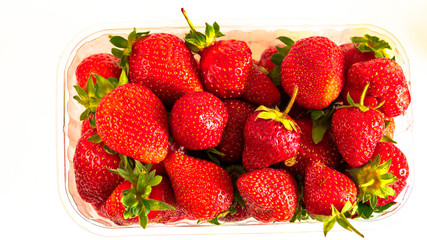 strawberries in a glass on a white background