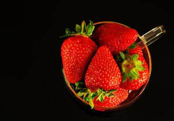 strawberries and bananas are on the table 
