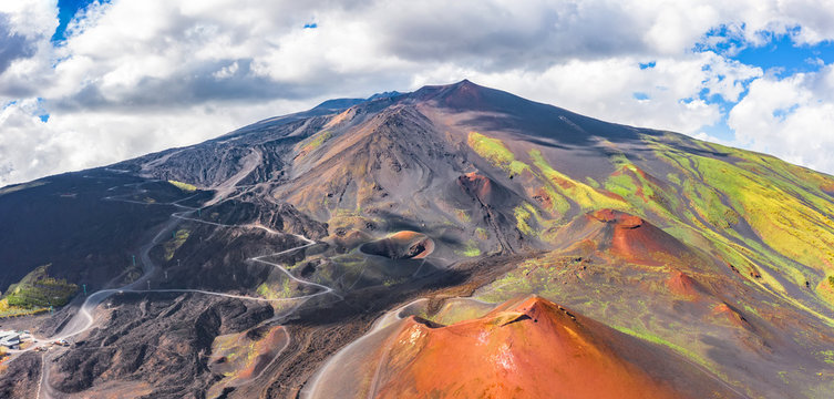 Panoramic wide view of the active volcano Etna, extinct craters on the slope, traces of volcanic activity.