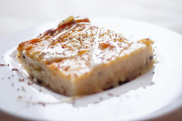 Cottage cheese casserole with condensed milk on a plate. Baking from cottage cheese.