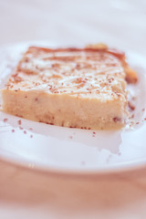 Cottage cheese casserole with condensed milk on a plate. Baking from cottage cheese.