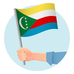 Comoros flag in hand