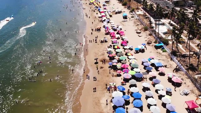 Aerial view of a beach full of people in Mexico