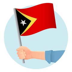 East Timor flag in hand