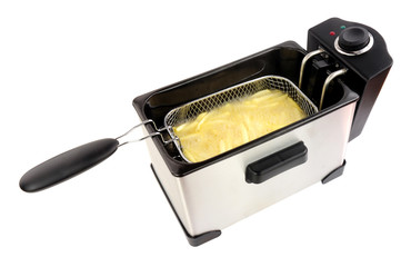 Electric oil fryer appliance frying French fries isolated on a white background