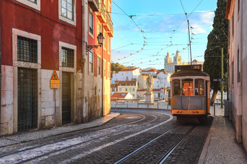 Fototapeta na wymiar An old traditional tram carriage in the city centre of Lisbon, Portugal. The city kept old traditional tram in service within the historical part of the capital