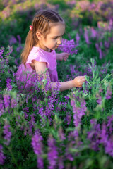 portrait smiling toddler girl in lavender field