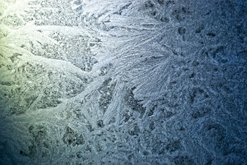  Crystal patterns on the glass in the frosty winter