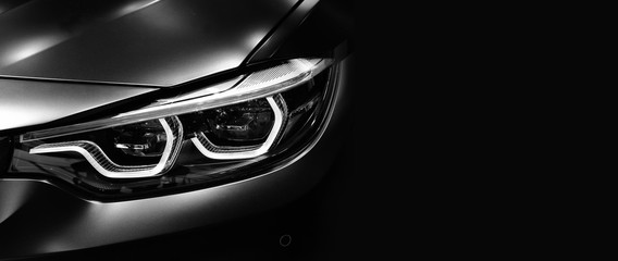 Fototapeta Detail on one of the LED headlights modern car on black background obraz