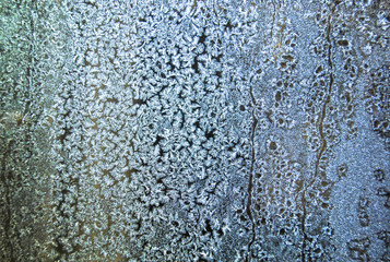  Crystal patterns on the glass in the frosty winter