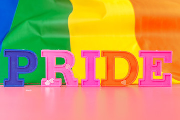 text pride, with lgbt rainbow flag
