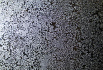  Crystal patterns on the glass in the frosty winter