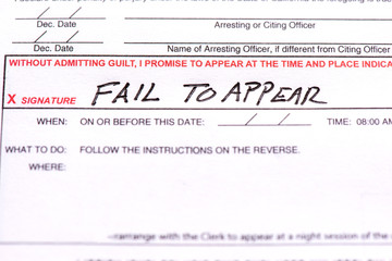 A traffic ticket with the words "Fail to appear" on it.