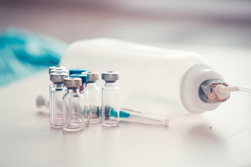 Medical background with  syringe and vaccine bottles