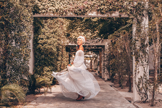beautiful young fashionable woman in turban outdoors at sunset - Powered by Adobe