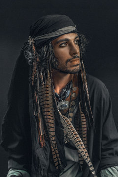 stylish handsome man in pirate costume