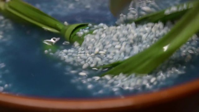 Preparing Nasi Kerabu or Blue Rice - Traditional Malaysian Dish