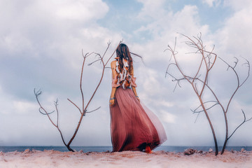 Beautiful young boho style woman outdoors with dry branches. Spiritual concept. Double exposure