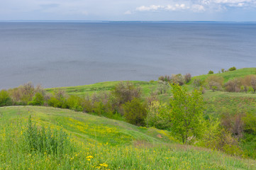Fototapeta na wymiar Spring hilly landscape Kakhovka Reservoir riverside located on the Dnipro River near Skelki village, Ukraine