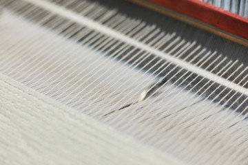 Textile factory machine weaving close up