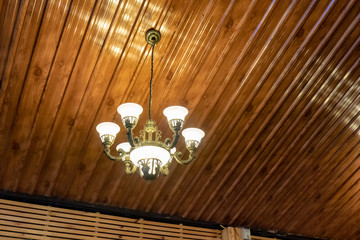 Retro chandelier lamp illuminate hanging on ceiling