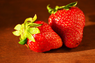 Ripe strawberries on wooden board, vintage summer photo