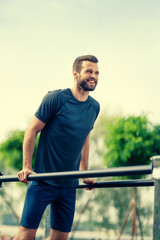Photo of man, doing push ups exercise, outdoors