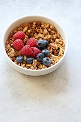 Granola with fresh berries. Healthy gluten free vegetarian breakfast