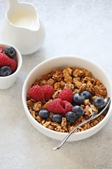 Granola with fresh berries. Healthy gluten free vegetarian breakfast