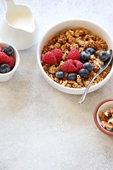 Granola with fresh berries. Healthy gluten free vegetarian breakfast